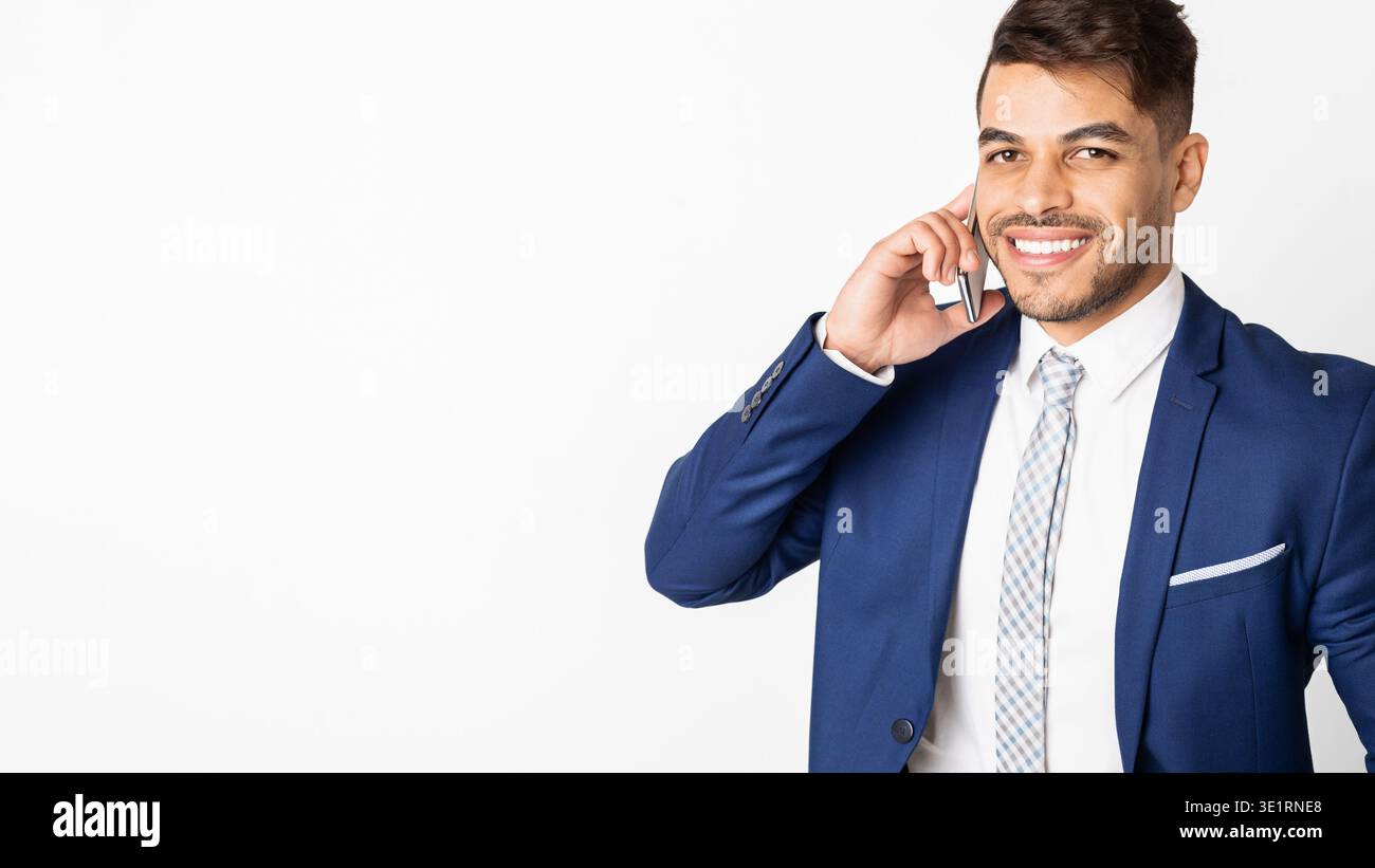 Arab businessman talking on phone and smiling Stock Photo