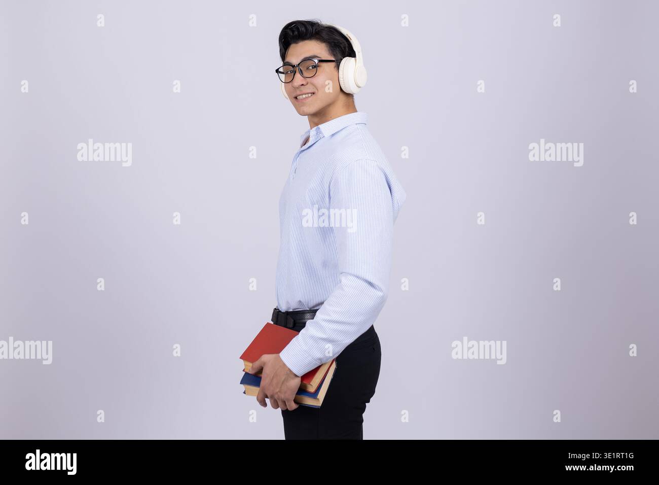 Student with notebook and backpack posing Stock Photo