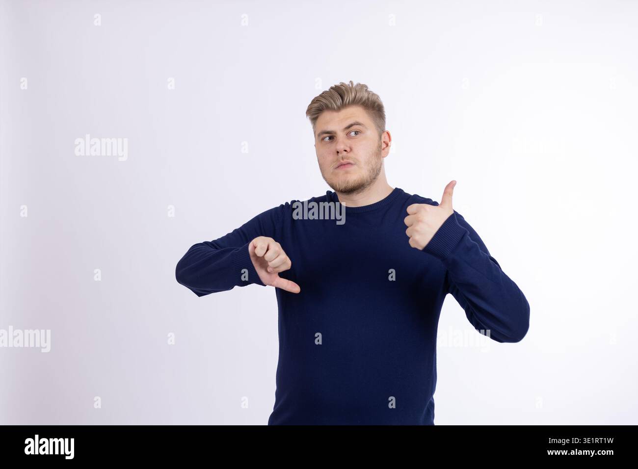 Young man pointing at himself with thumbs Stock Photo