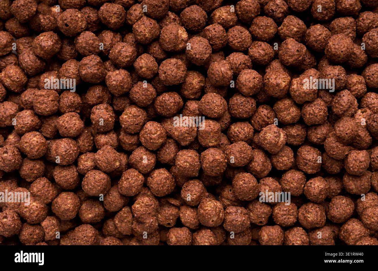 Chocolate breakfast cereal balls background Stock Photo