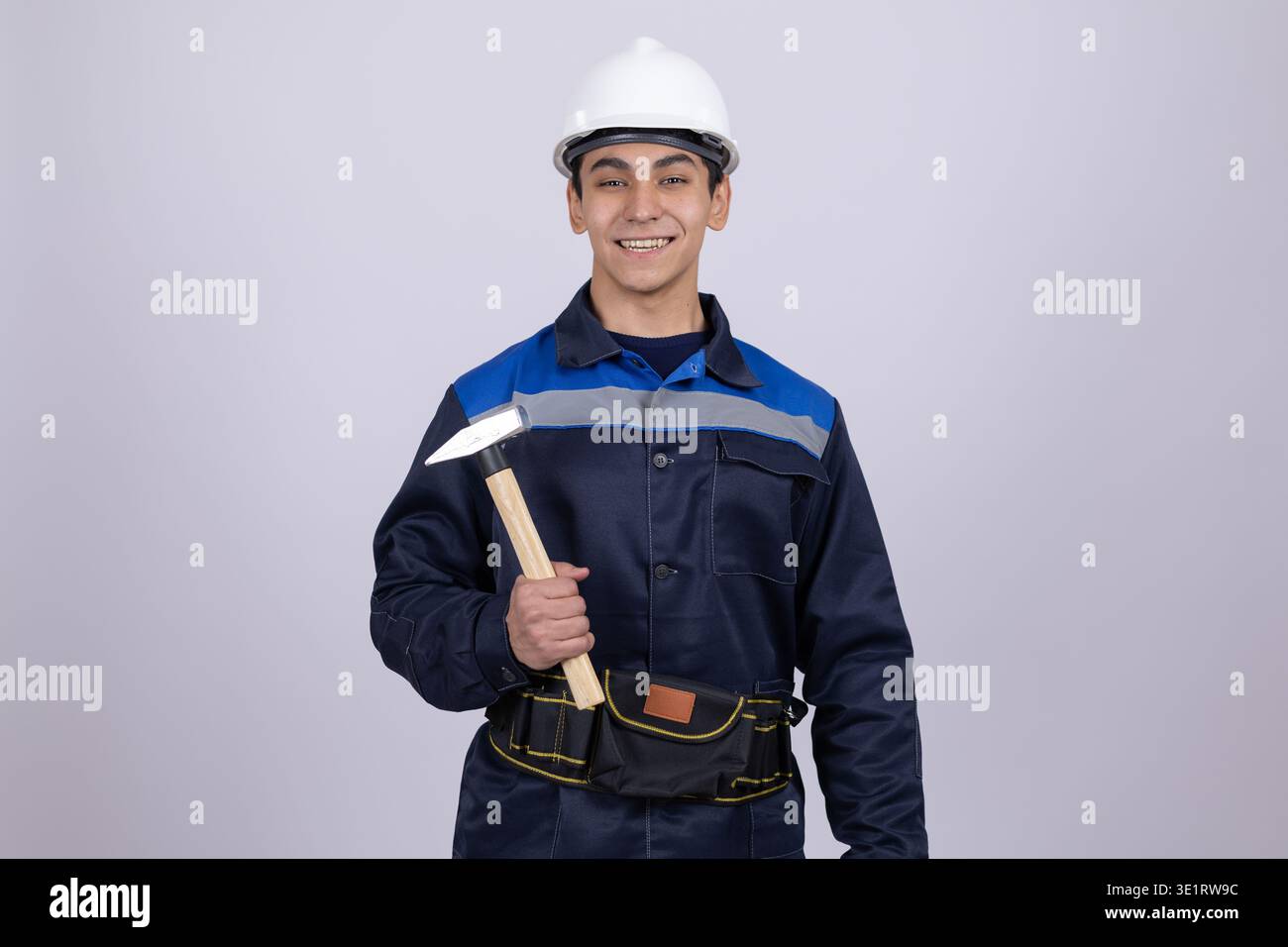 Construction worker holding a hammer Stock Photo