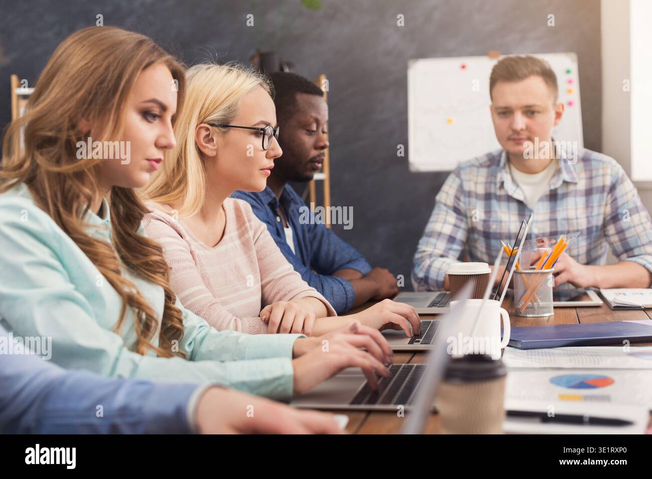 Programmers working in software developing company Stock Photo