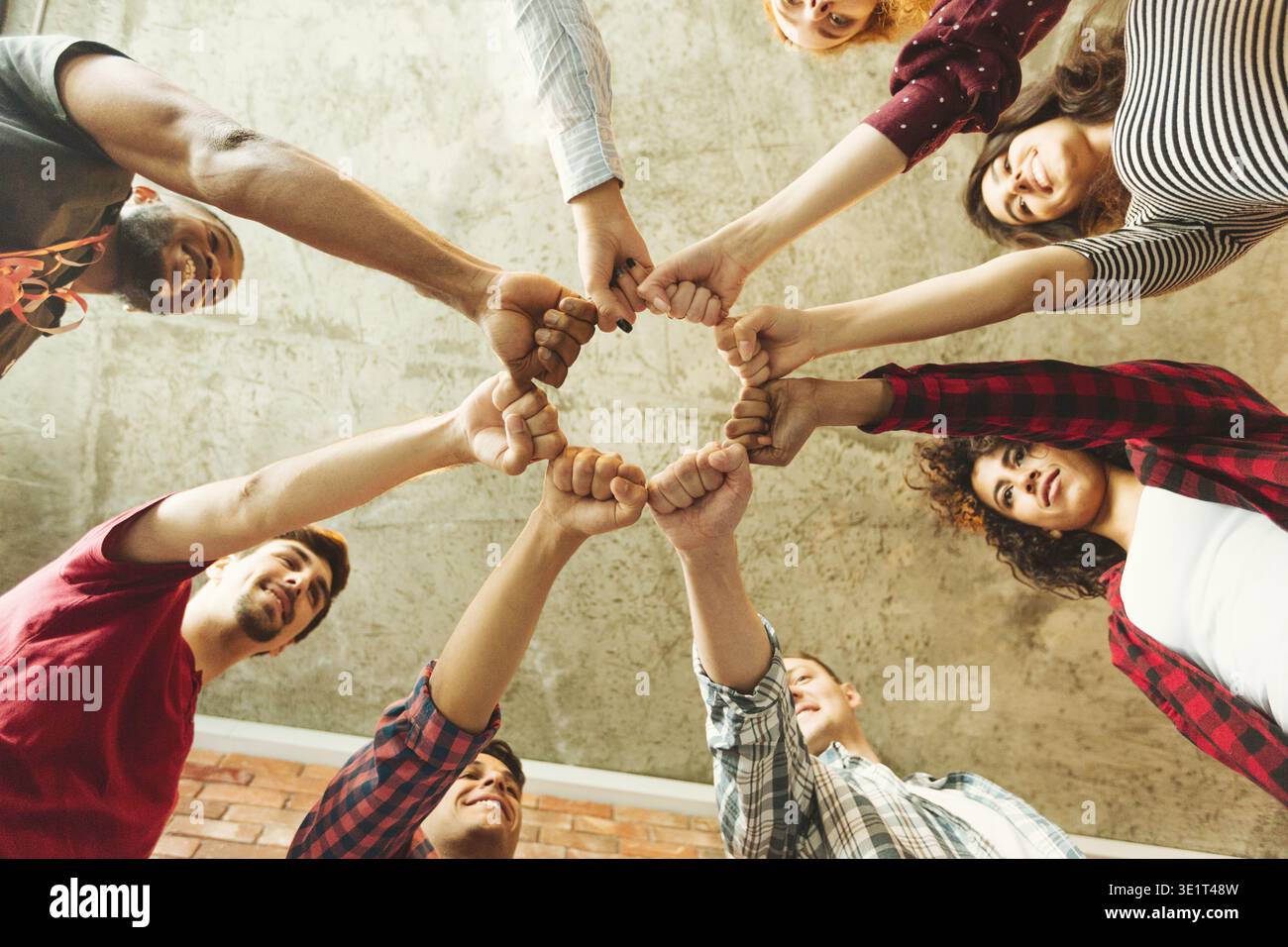 Group of People Joining Hands in a Circle to Show Unity and Teamwork at ...