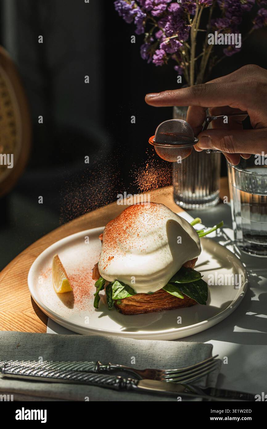Salmon toast with poached egg and spinach Stock Photo
