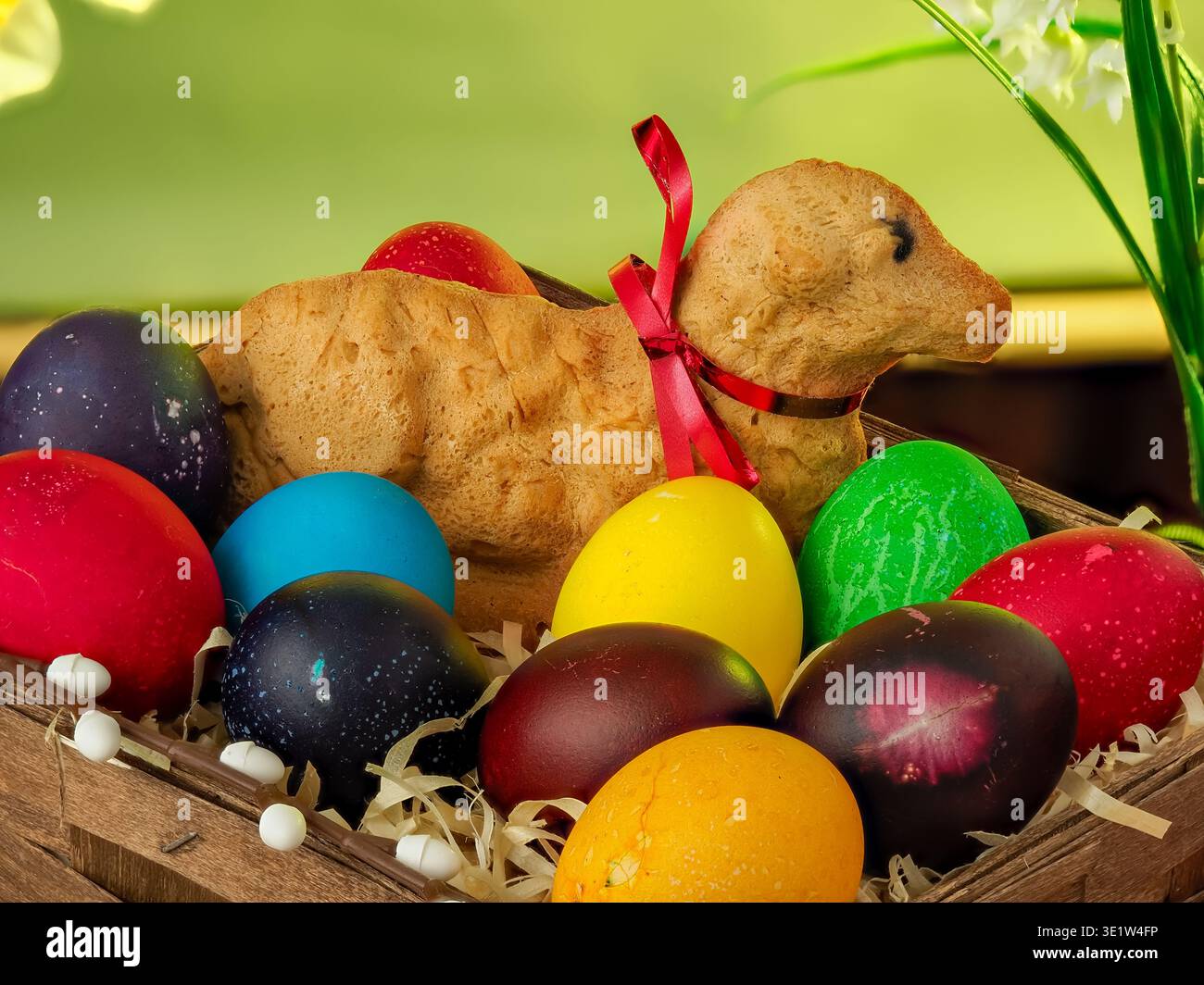 lamb made of bread, eggs painted in different colors, background, wallpaper, Easter composition, festive details Stock Photo