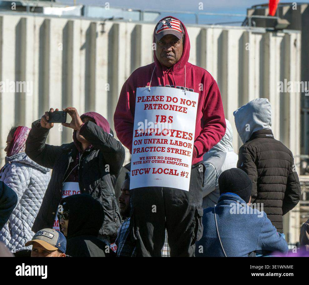 Workers from the JBS Beef Plant protest across the road from the plant ...