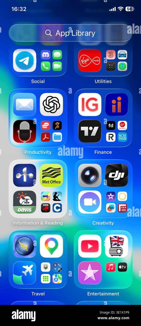 Smartphone app library screen showing grouped mobile apps for social, finance, productivity and travel on iOS interface. Stock Photo