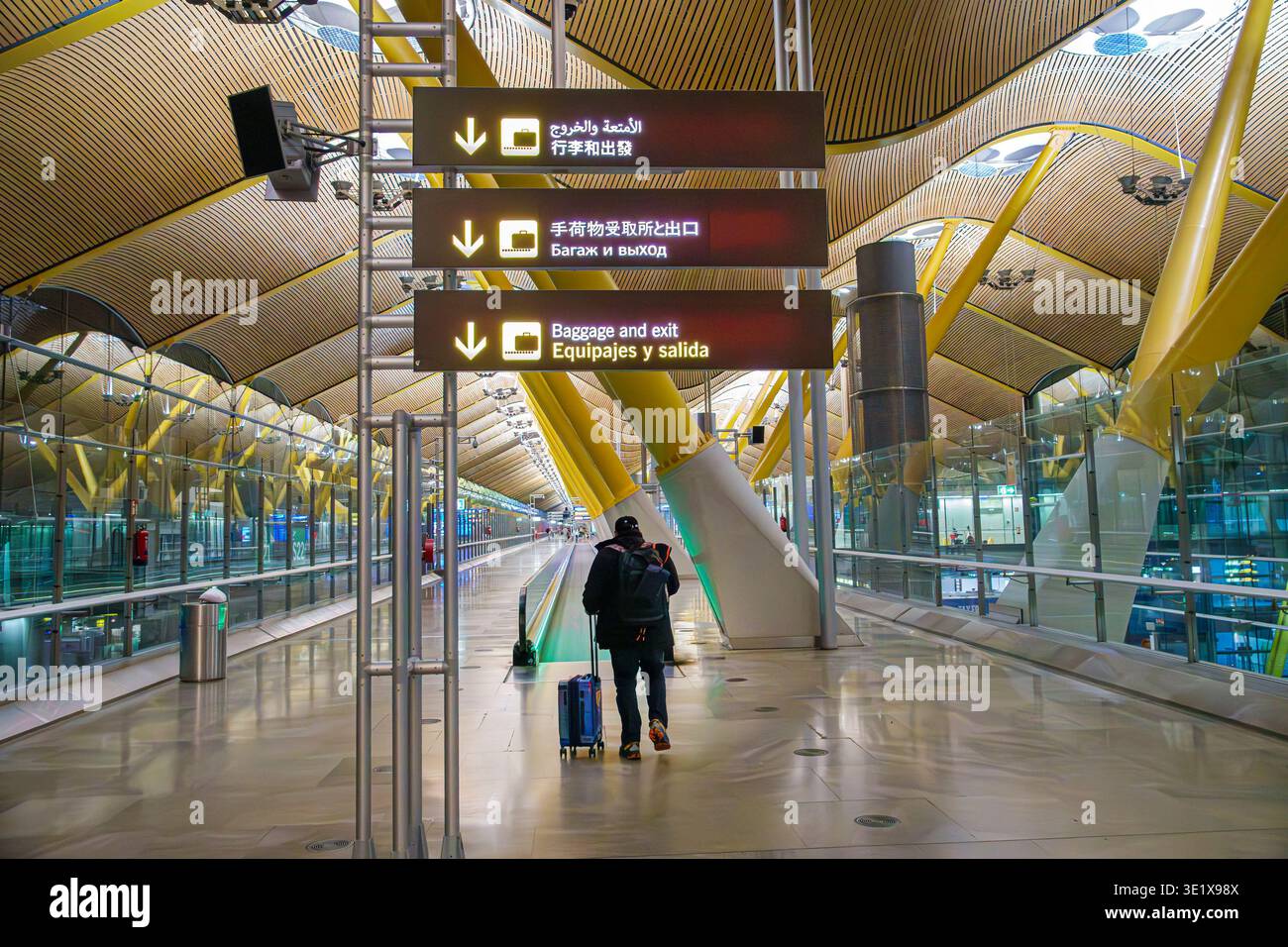 Madrid Spain,MAD Adolfo Suarez Madrid-Barajas Airport,inside interior terminal,baggage and exit sign Equipajes y salida,airport direction signs multil Stock Photo