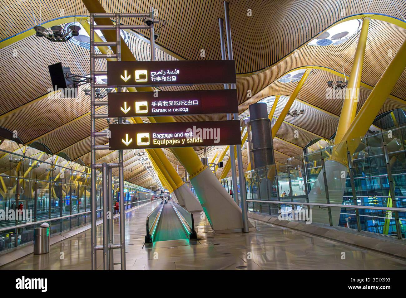 Madrid Spain,MAD Adolfo Suarez Madrid-Barajas Airport,inside interior terminal,baggage and exit sign Equipajes y salida,airport direction signs multil Stock Photo