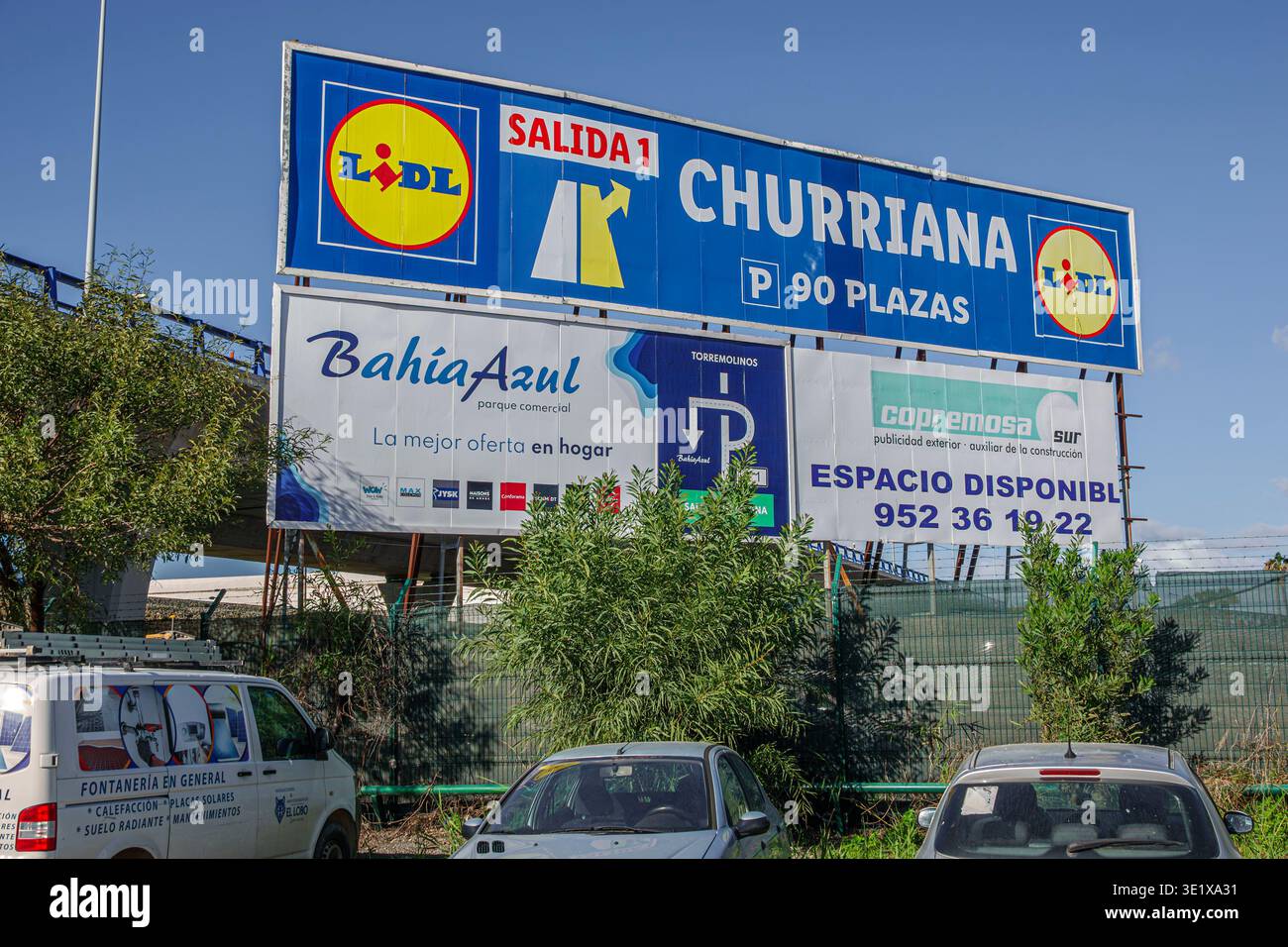Malaga Spain,Andalusia Andalucia,Lidl supermarket sign,Churriana exit road sign,Salida exit,P 90 plazas parking spaces,Bahia Azul parque comercial sho Stock Photo