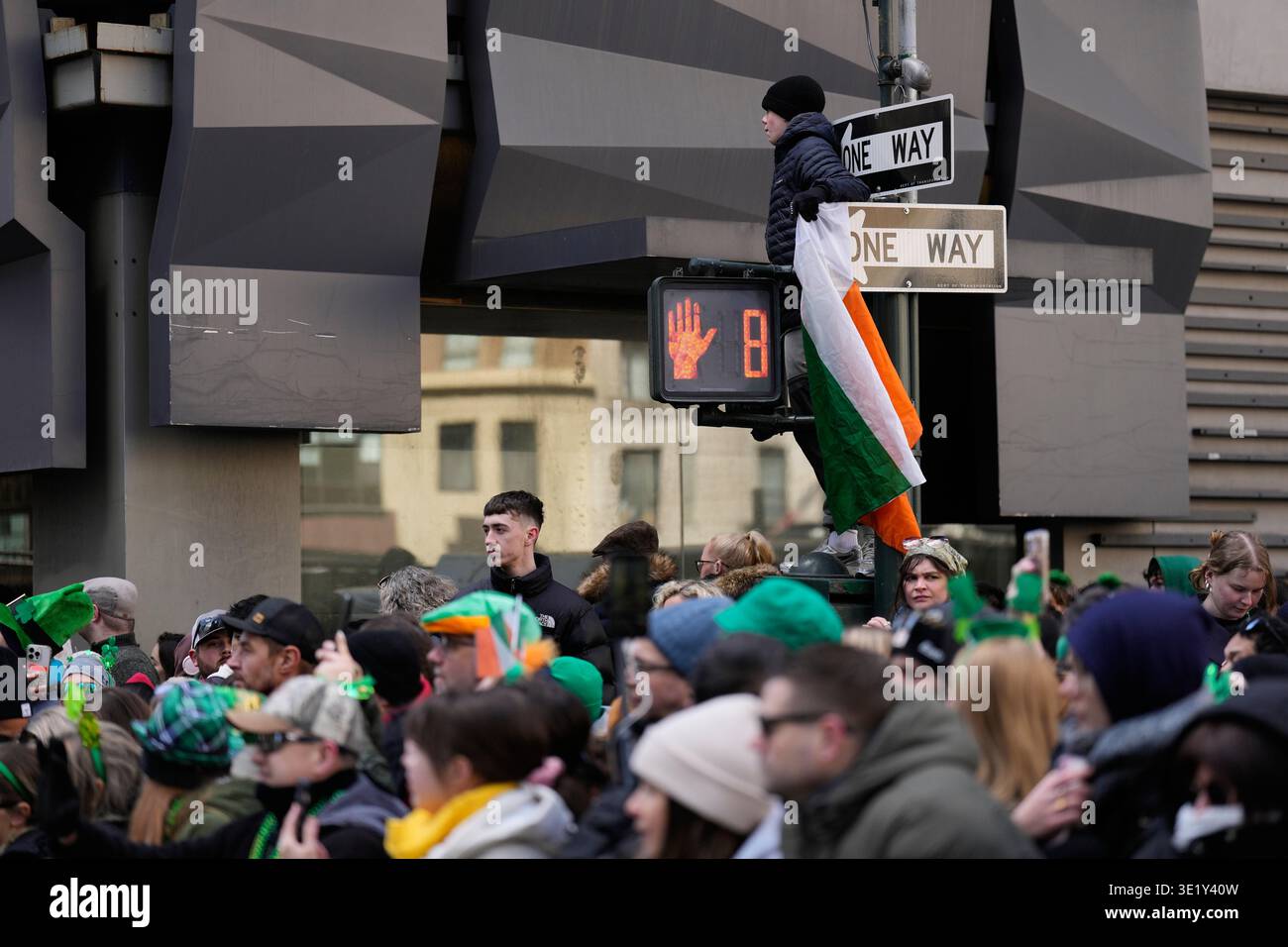 People watch the St. Patrick's Day parade in New York, Tuesday, March ...