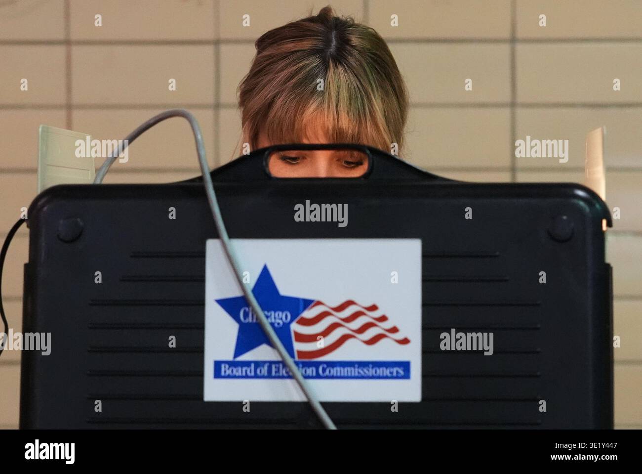 Democratic candidate for Congress Kat Abughazaleh casts her ballot on ...