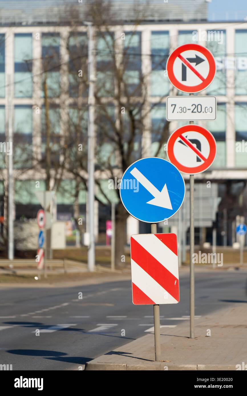 Road signs showing mandatory direction and turning limits on urban ...