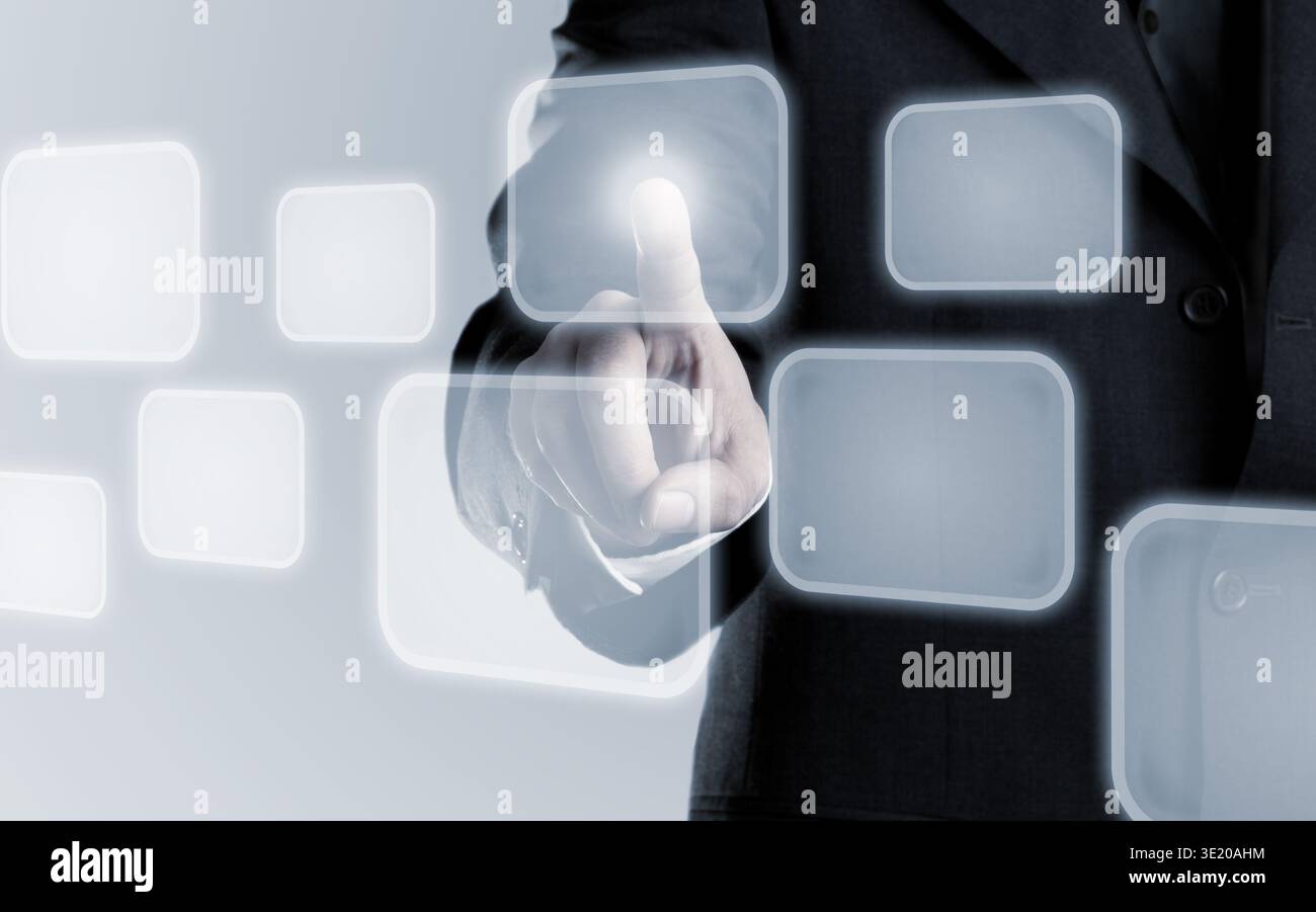 Businessman touching infogram graphics on virtual touchscreen with copy space Stock Photo