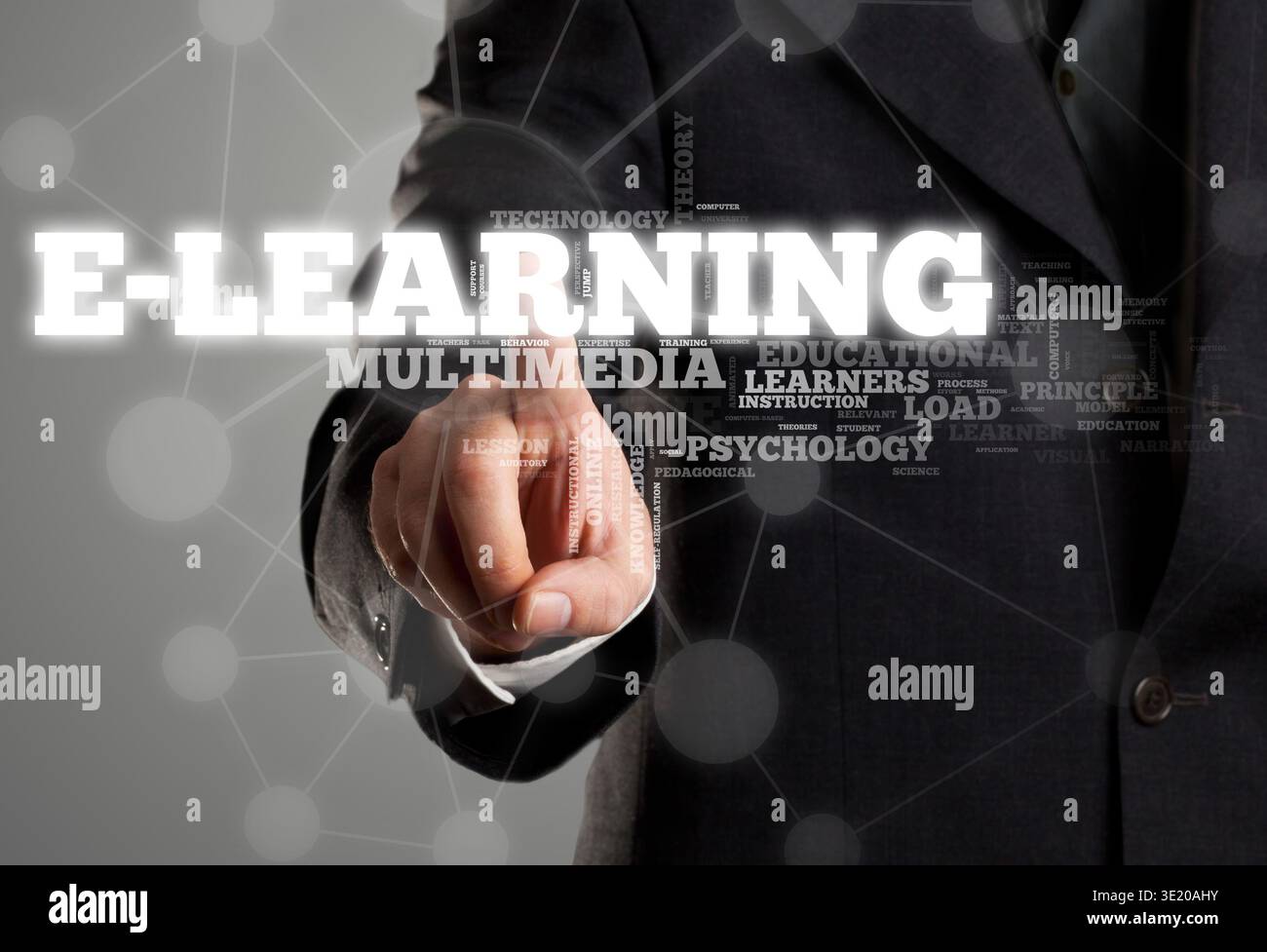 Businessman touching e-learning in wordcloud on transparent surface display Stock Photo