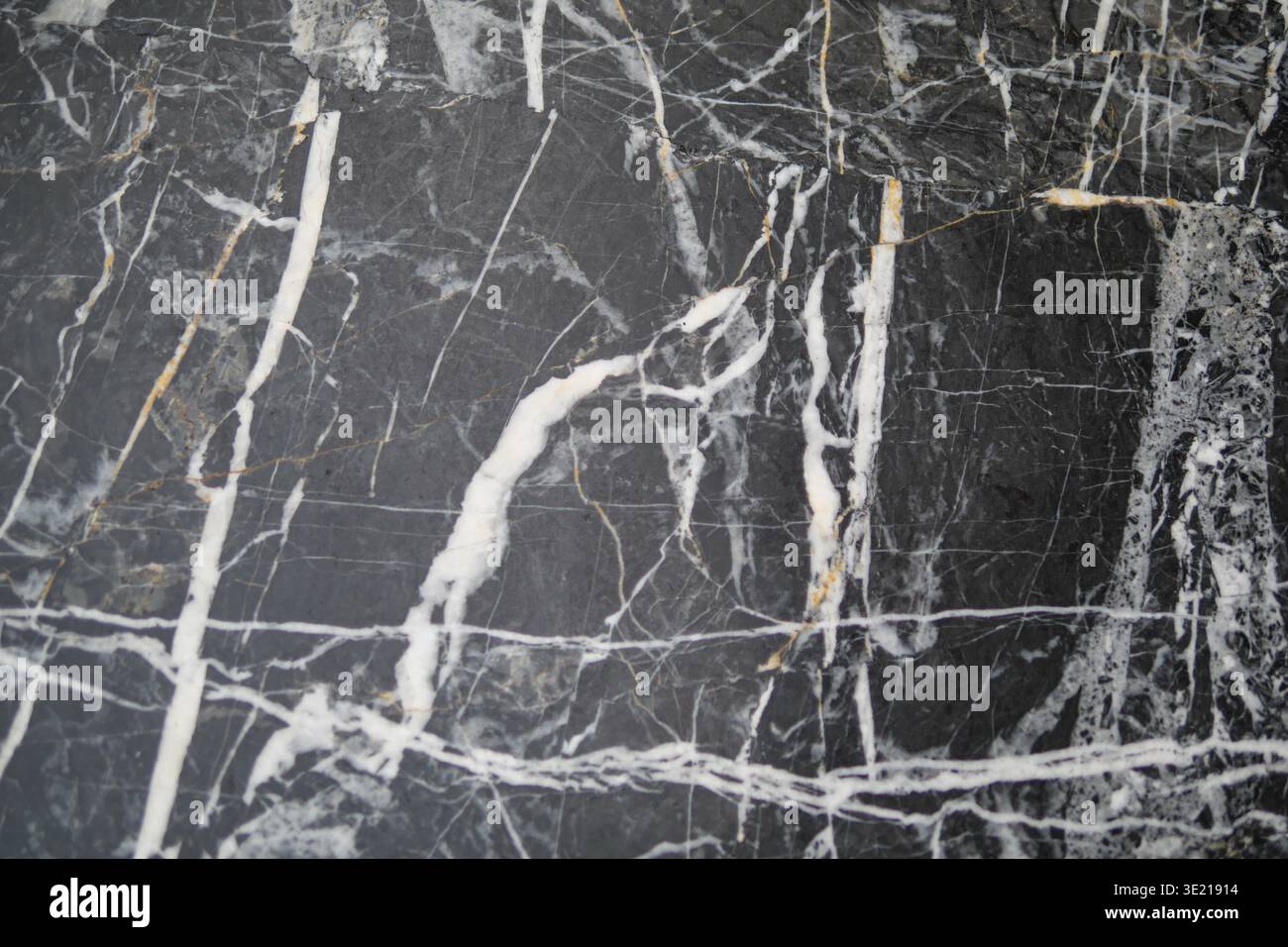 Dark stone surface with white veins and patterns Stock Photo