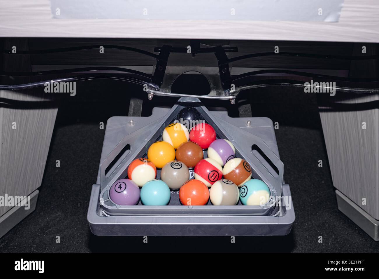 Closeup of Billiard Balls Arranged in Triangle Rack on Pool Table Stock Photo