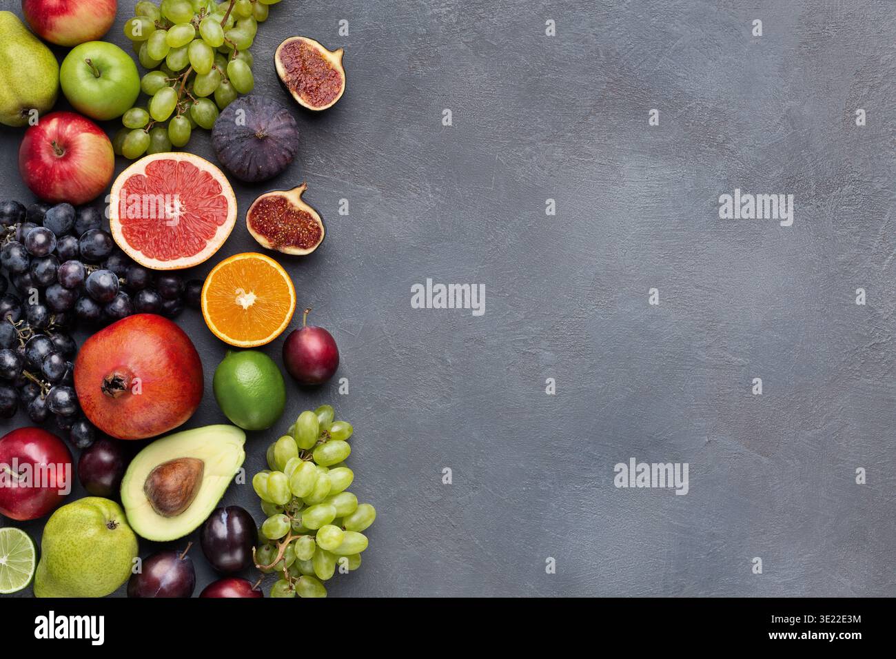 Fresh fruits border on gray background top view Stock Photo