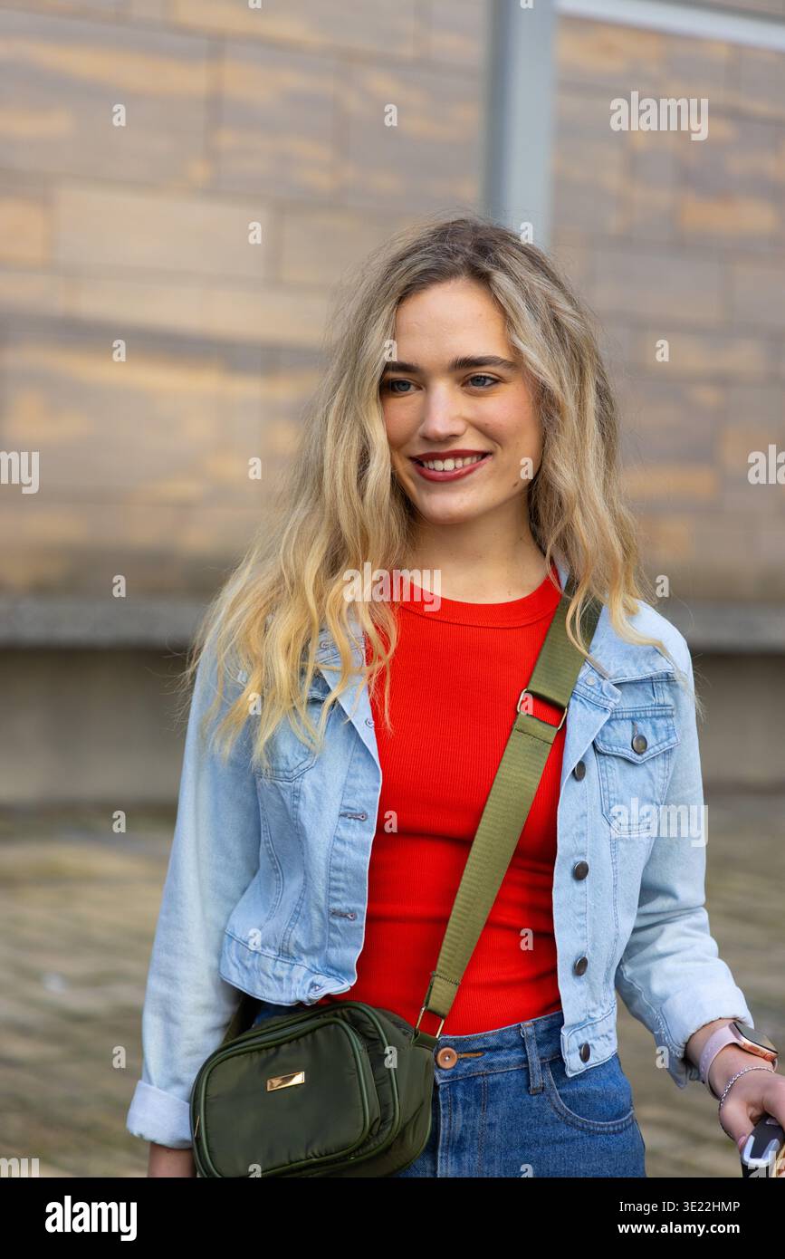Wearing red top and blue jeans hi-res stock photography and images - Alamy