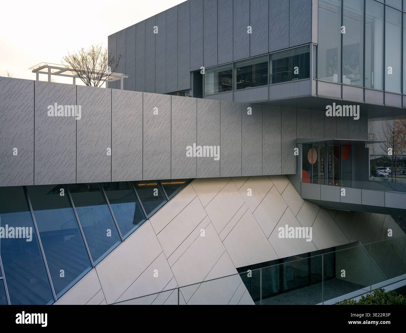 Wide exterior view of a contemporary corporate building featuring bold ...