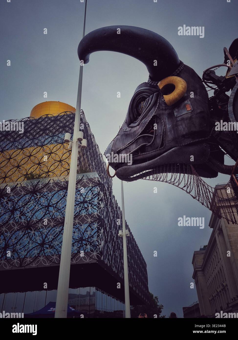 Profile of Ozzy the Bull in Centenary Square, Birmingham with the Library of Birmingham behind - Smartphone Captured Stock Image