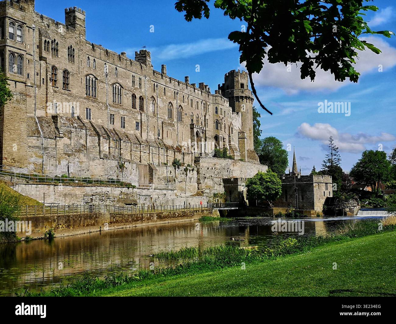 View of Warwick Castle's south facade from River Island, with the River Avon flowing in front - Smartphone Captured Stock Image