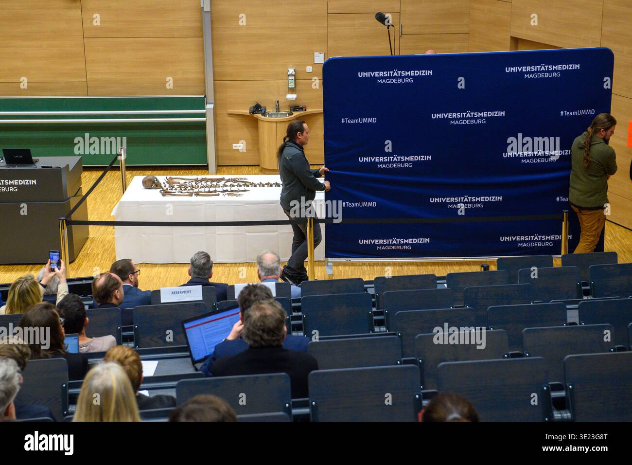 Klaus Rulker Magdeburg, Germany. 18th Mar, 2026. Helpers in the lecture hall of ...