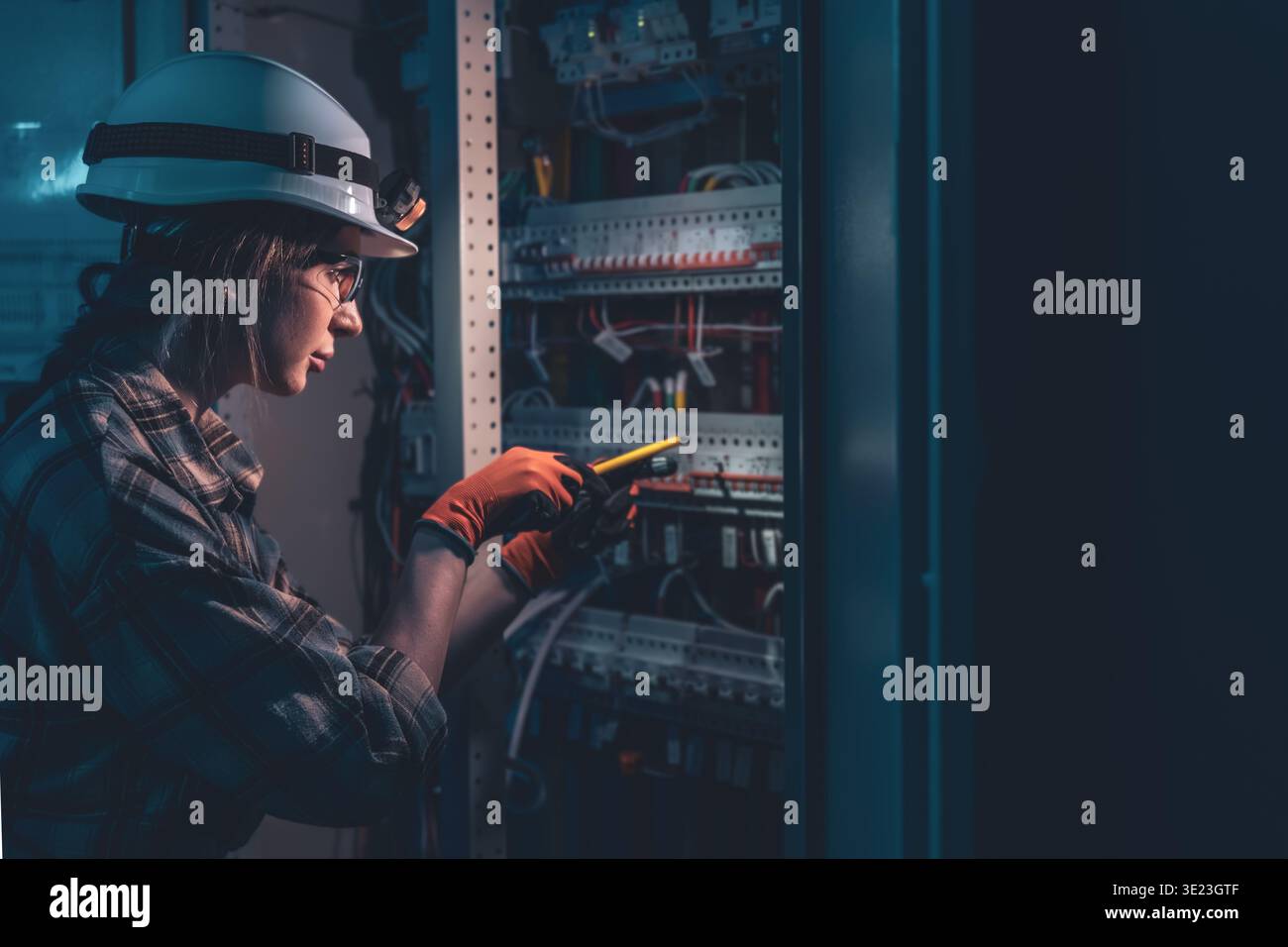 Machine Testing Switchboard Electrician testing electrical switchboard with voltage tester ...