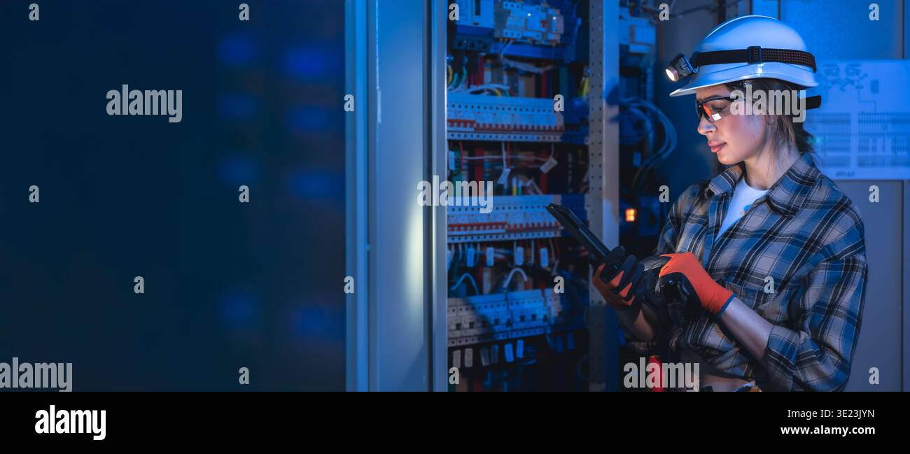 Electrical engineer inspecting power system using tablet. Technical maintenance. Stock Photo
