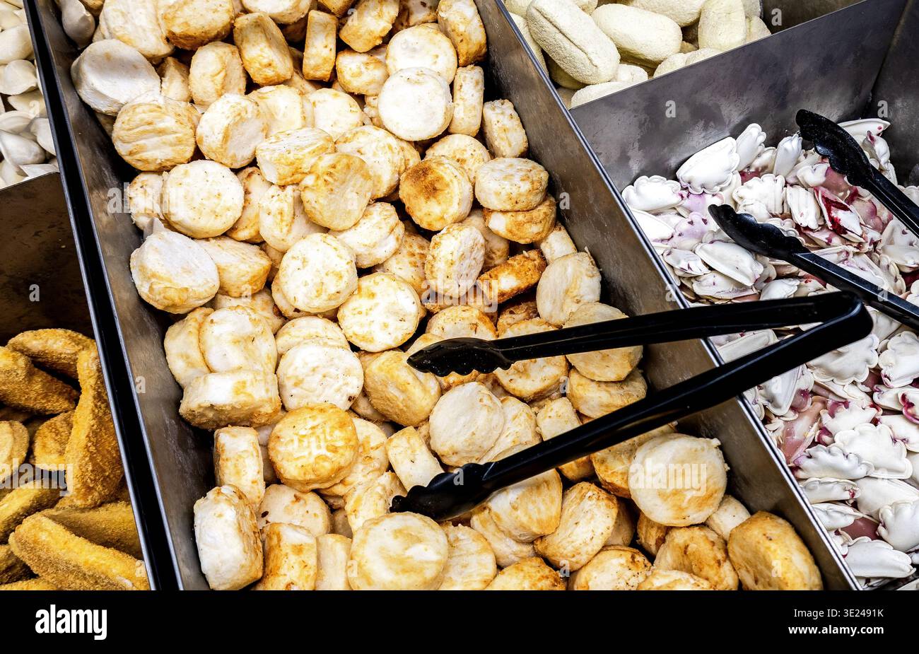 Sale of frozen semi-finished products. Showcase with tasty different semi-finished products in chain hypermarket Stock Photo
