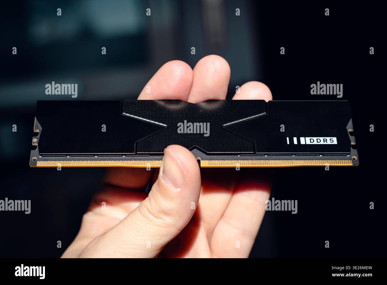 Fast DDR5 memory module held in hand. Stock Photo