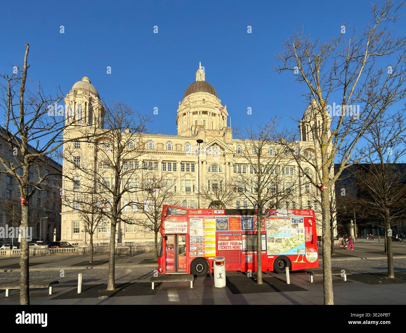 Tour bus selling tickets and The Port Authority Building, one of the three Graces at Pier Head, Liverpool - Smartphone Captured Stock Image