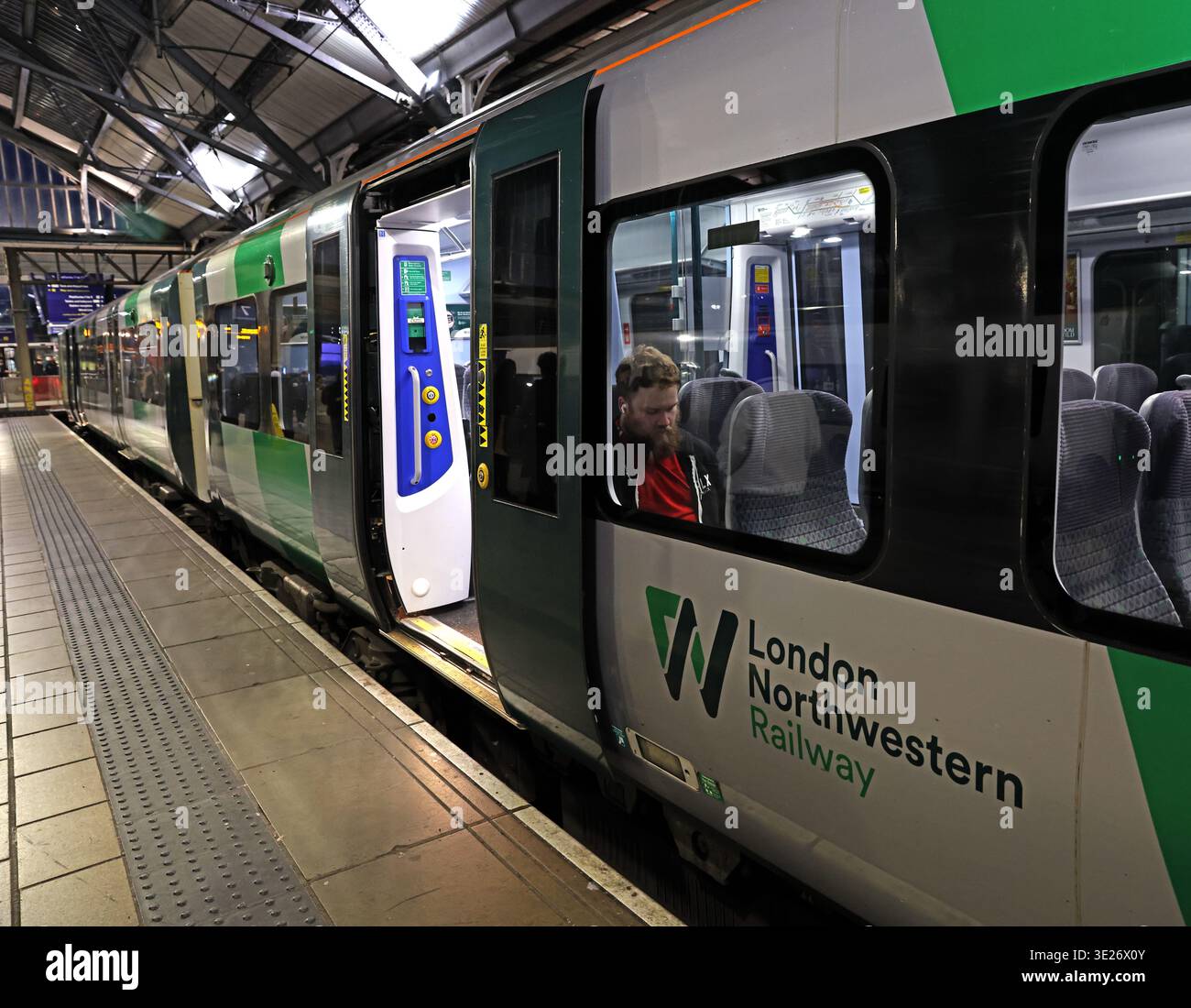 London Northwestern Railway train at Liverpool Lime Street station platform in the evening, Liverpool, Merseyside, England. Stock Photo