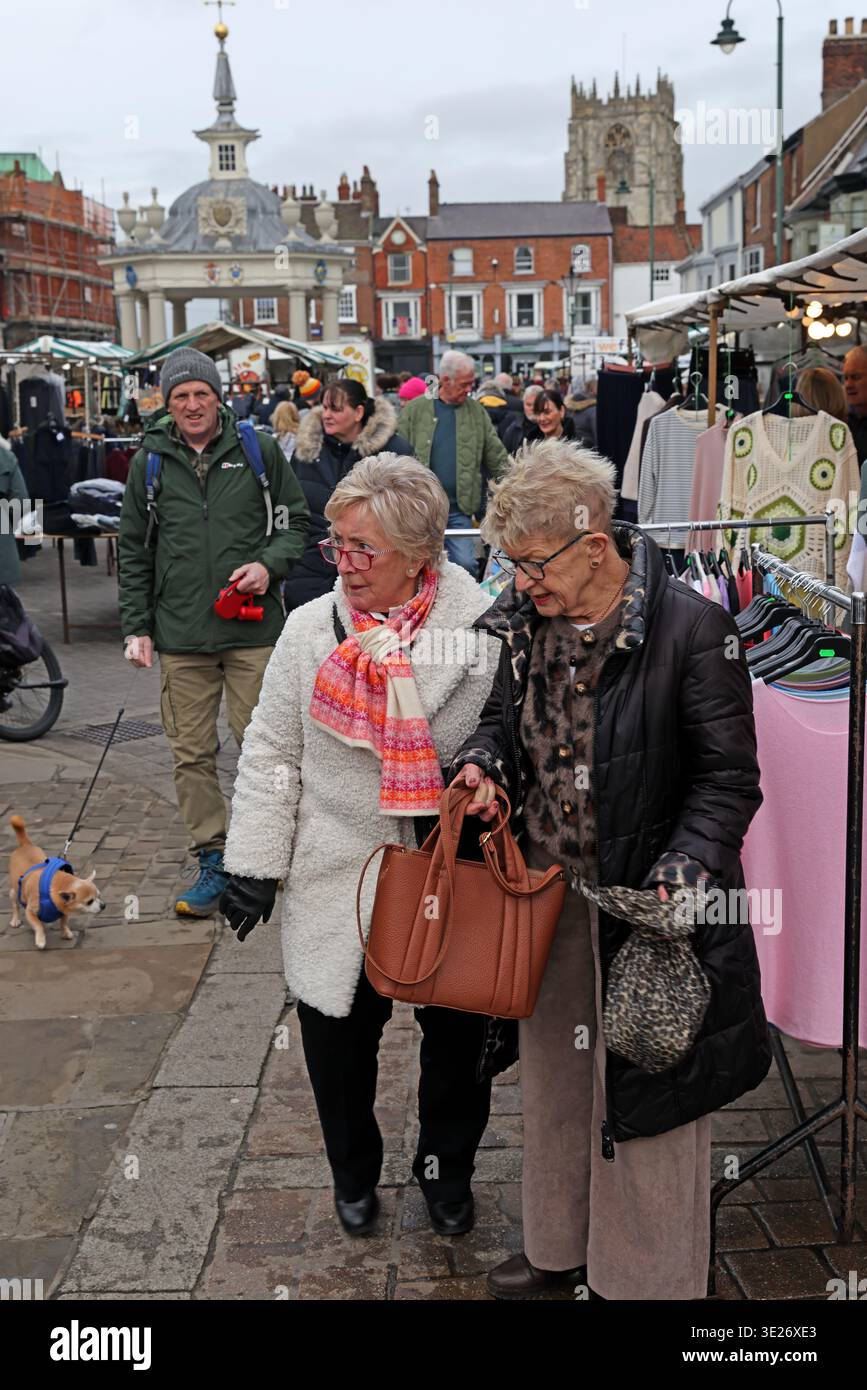 Busy Saturday Market day with shoppers in Beverley town centre, East Riding of Yorkshire, England, with Beverley Minster beyond. Stock Photo