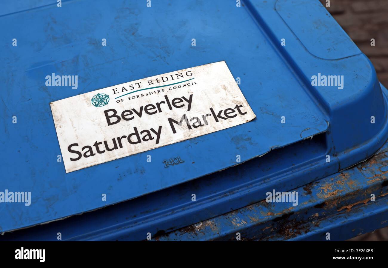 Blue market bin labelled Beverley Saturday Market, East Riding of Yorkshire, England, showing council-managed town centre infrastructure. Stock Photo