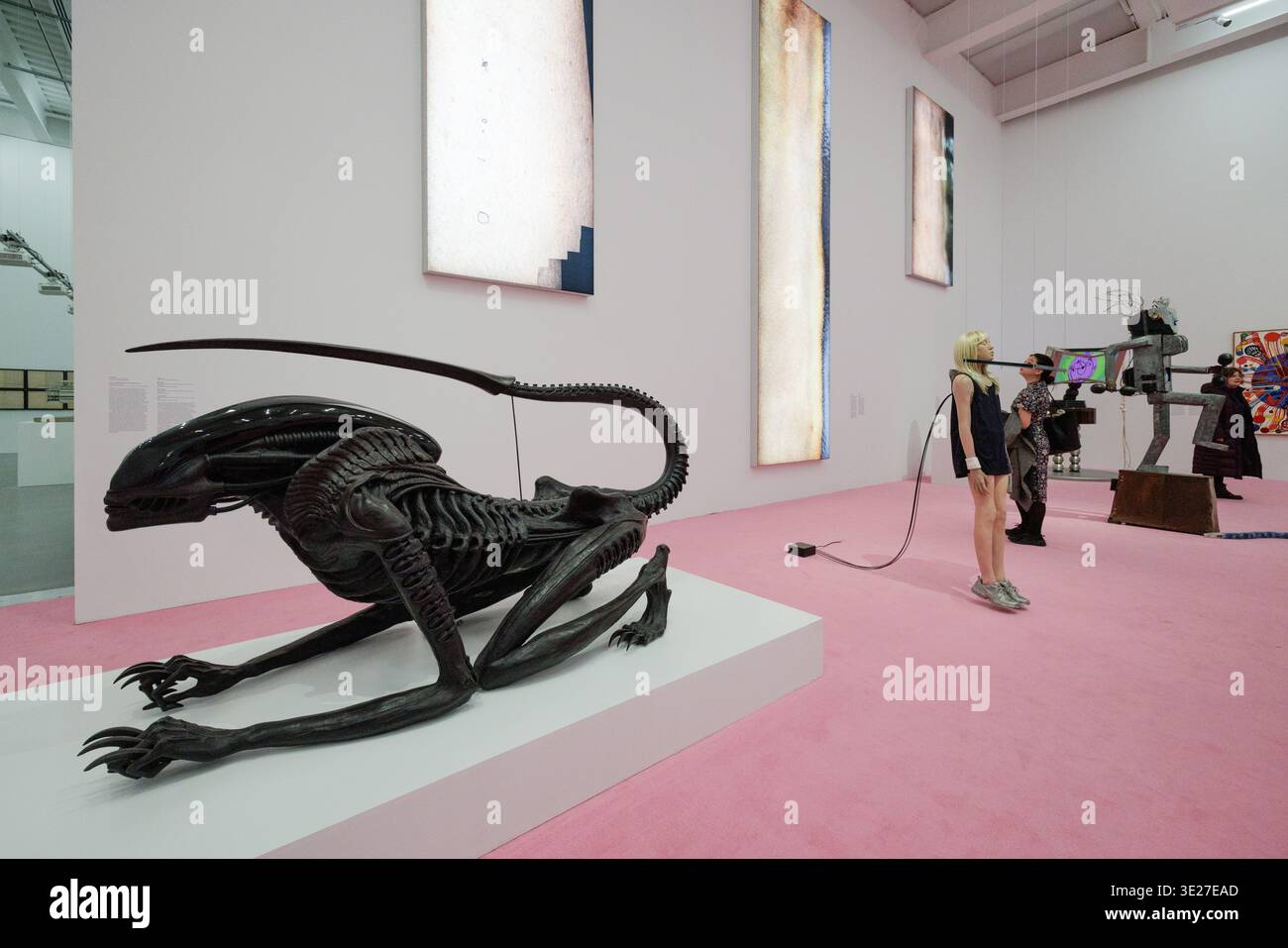 Gallery view with H.R. Giger alien sculpture, foreground, New Museum expansion opening exhibition, New York City, 3/18/26. Stock Photo
