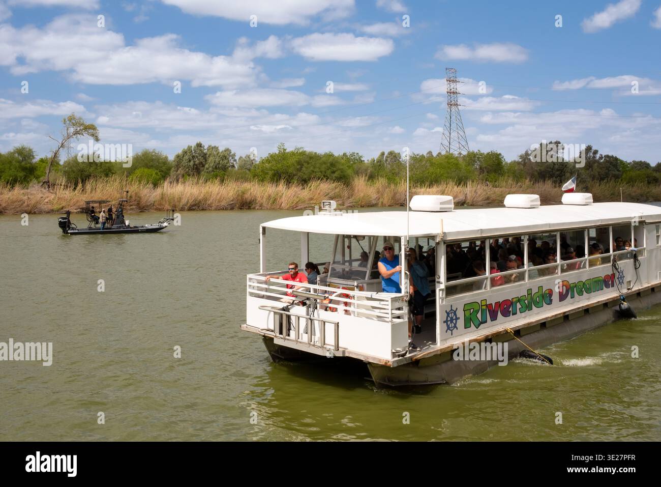 The Riverside Dreamer, a tour boat on the Rio Grande River, operated by the Riverside Club, Mexico in the background, Mission, Texas, USA. Stock Photo