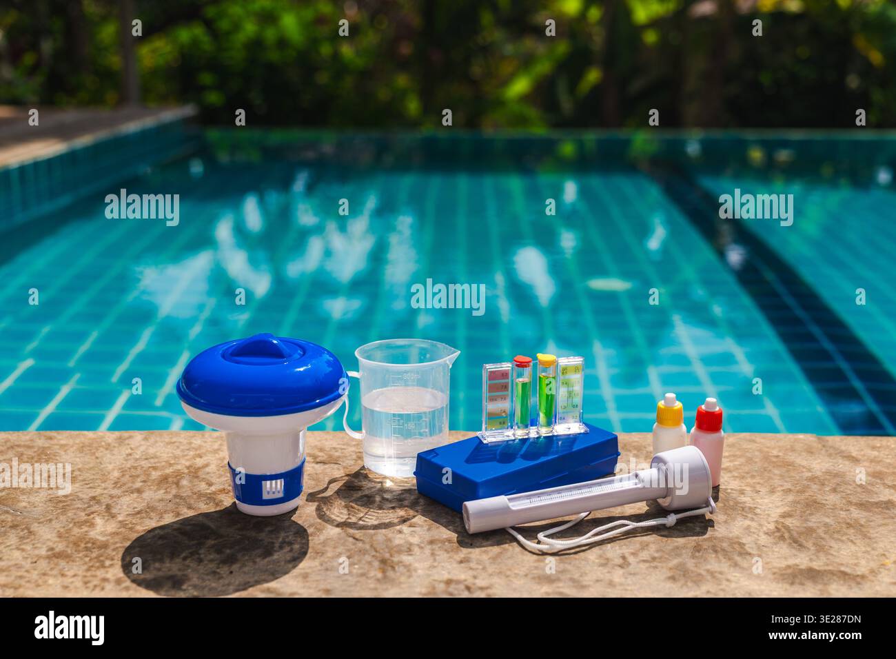 Ptag Pool Testing Pool water testing kit on pool edge showing pH and chlorine levels with ...