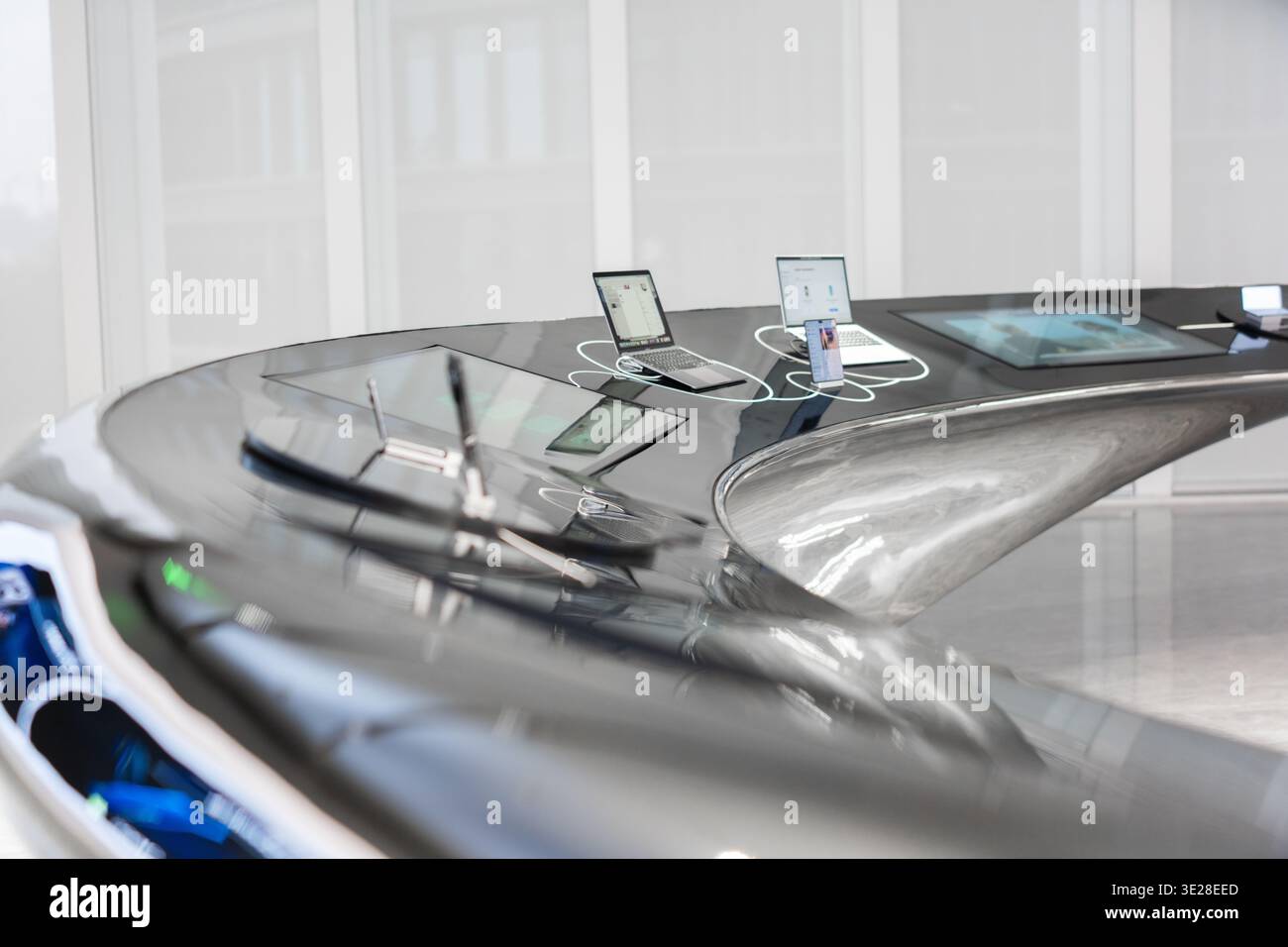 Sleek futuristic car interior with embedded tablets and digital displays, showcasing advanced Stock Photo