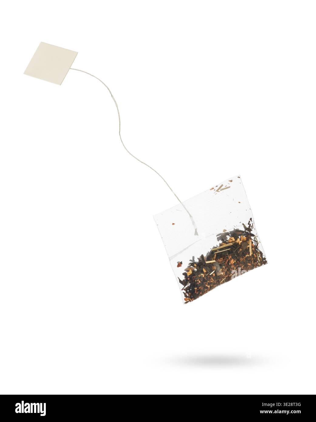 Filter tea bag with blanck label floating, isolated on white background. Stock Photo