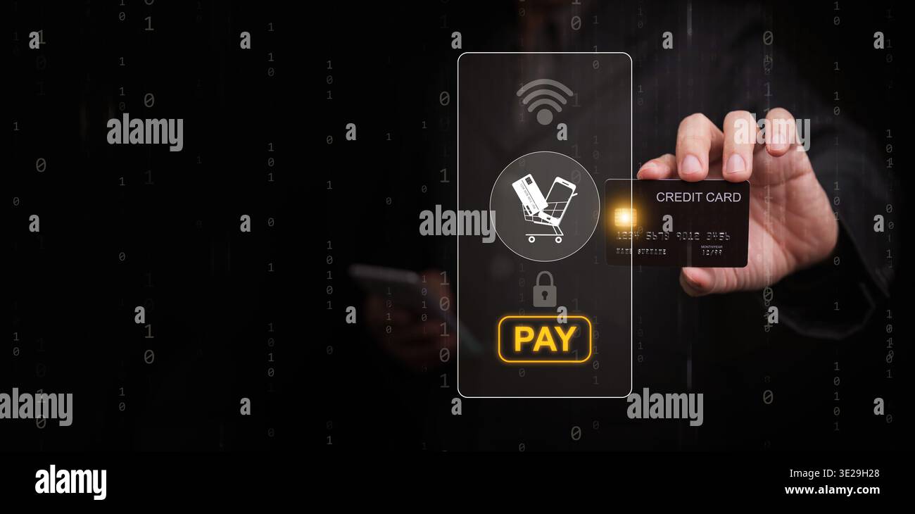Online payment concept with hand holding credit card and digital interface showing secure transaction, pay button, wireless connection, fintech techno Stock Photo