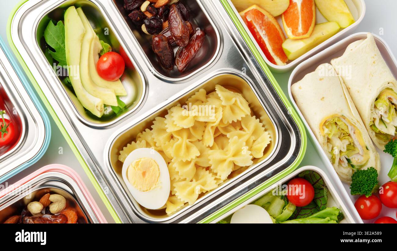 Different types of food in trays for a healthy meal plan at lunchtime ...