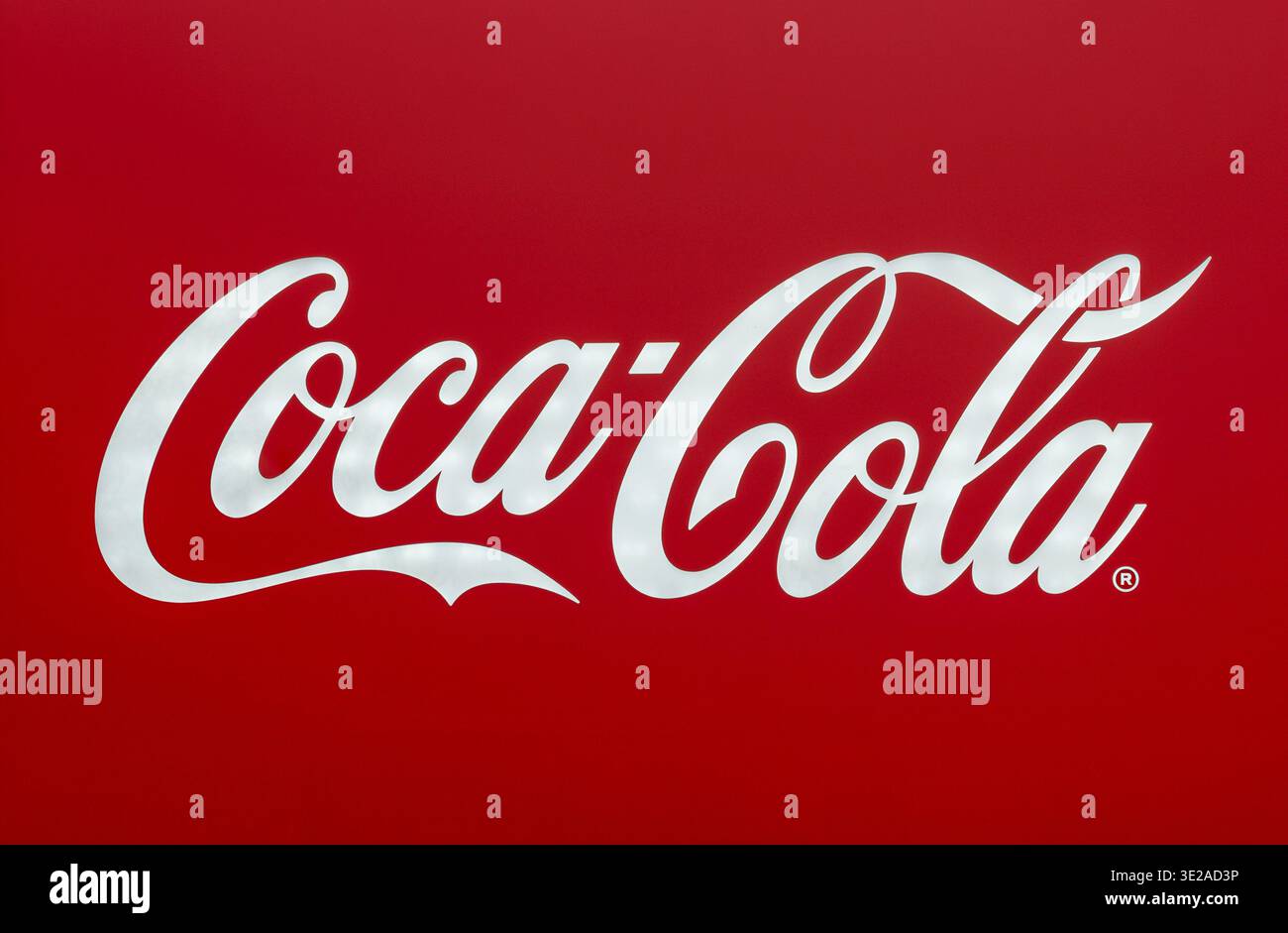 Milan, Lombardy, Italy - Friday 13, 2026: Coca Cola company logo featuring white script on a vibrant red background Stock Photo