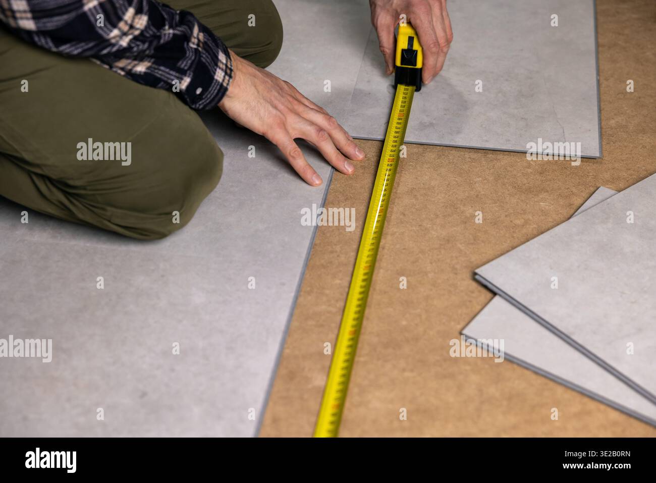 stone texture vinyl tile flooring installation Stock Photo