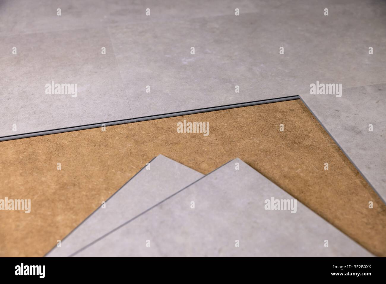 stone texture vinyl tile flooring installation Stock Photo