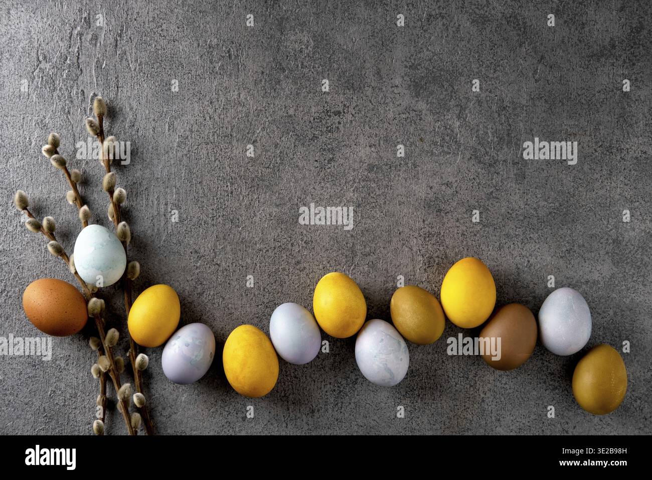 Natural dyed easter eggs. Happy Easter. Congratulatory easter background. Easter composition on grey concrete backgrount Stock Photo