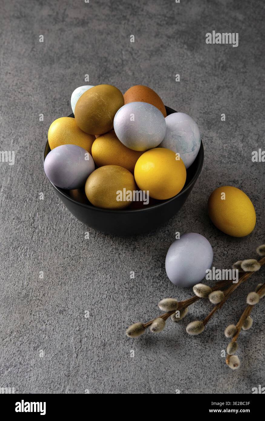 Natural dyed easter eggs. Happy Easter. Congratulatory easter background. Easter composition on grey concrete backgrount Stock Photo