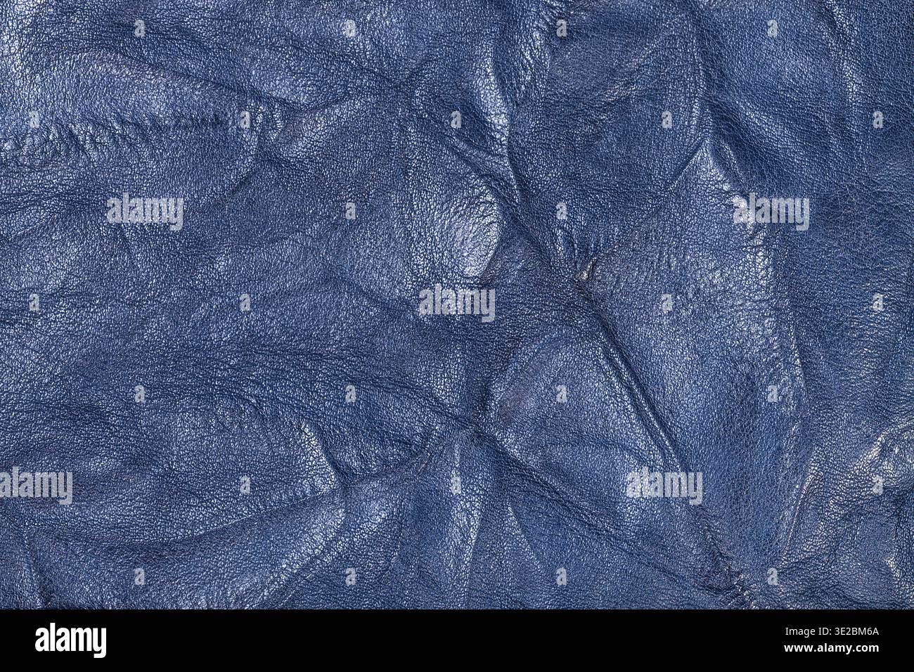 Textured background from blue crumpled leather close up Stock Photo
