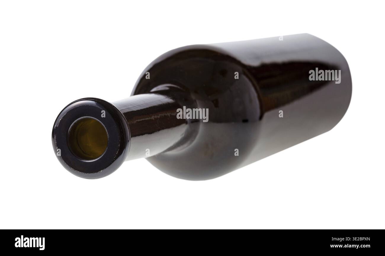 Overturned empty dark brown wine bottle isolated on white background Stock Photo