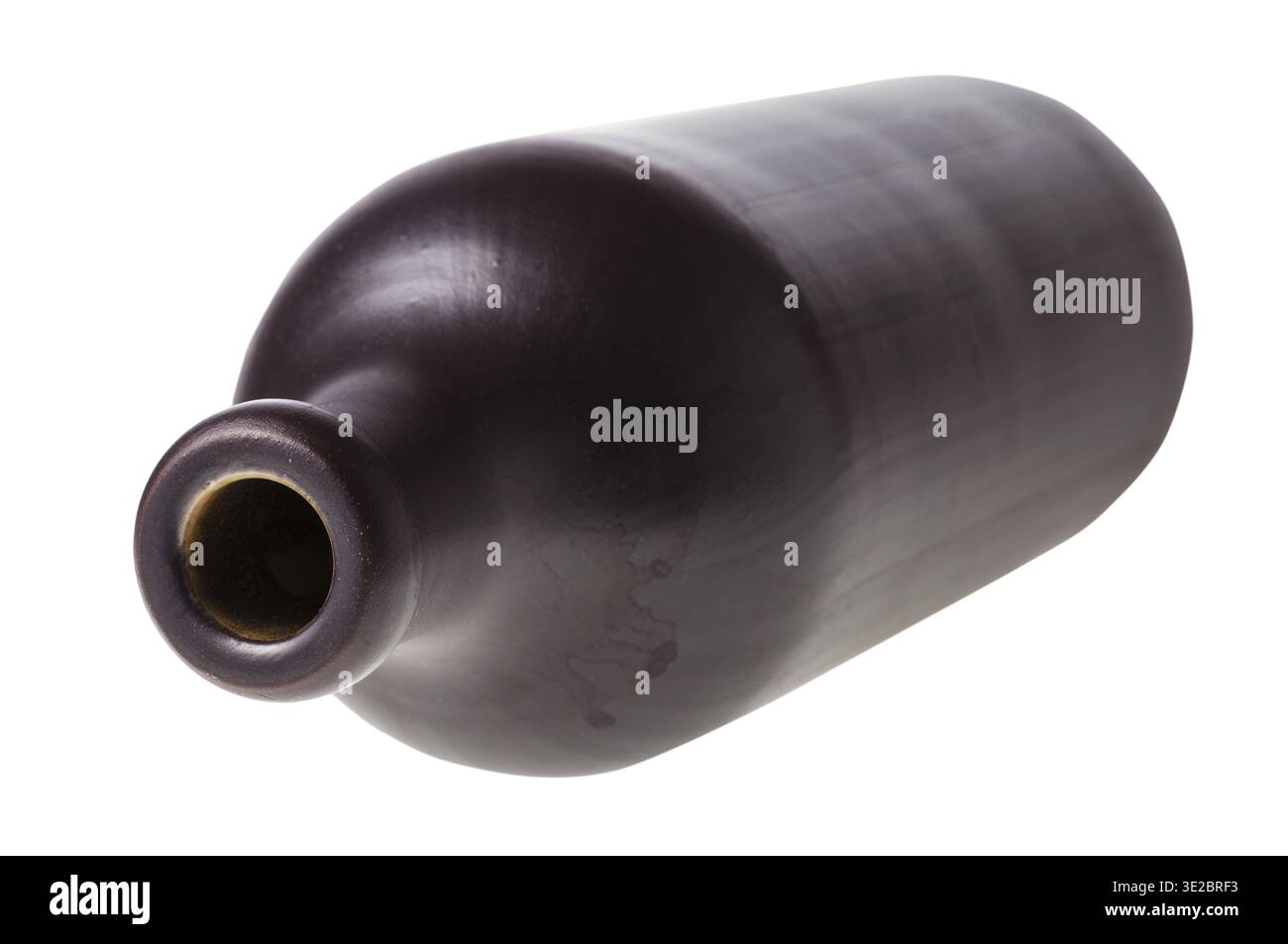 Overturned black ceramic bottle isolated on white background Stock Photo